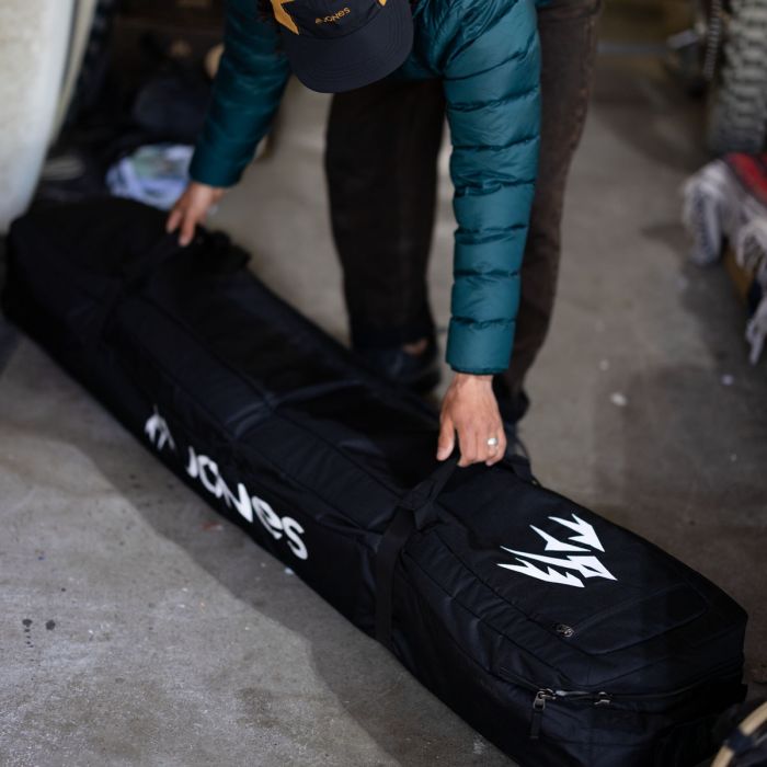 jones adventure snowboard bag Board 2025 Alpine East Oversized wheels and a skid plate keep the Adventure rolling smooth through airport terminals or city streets and four exterior handles provide multiple options for carrying or lifting Expedition Board Bag | Jones